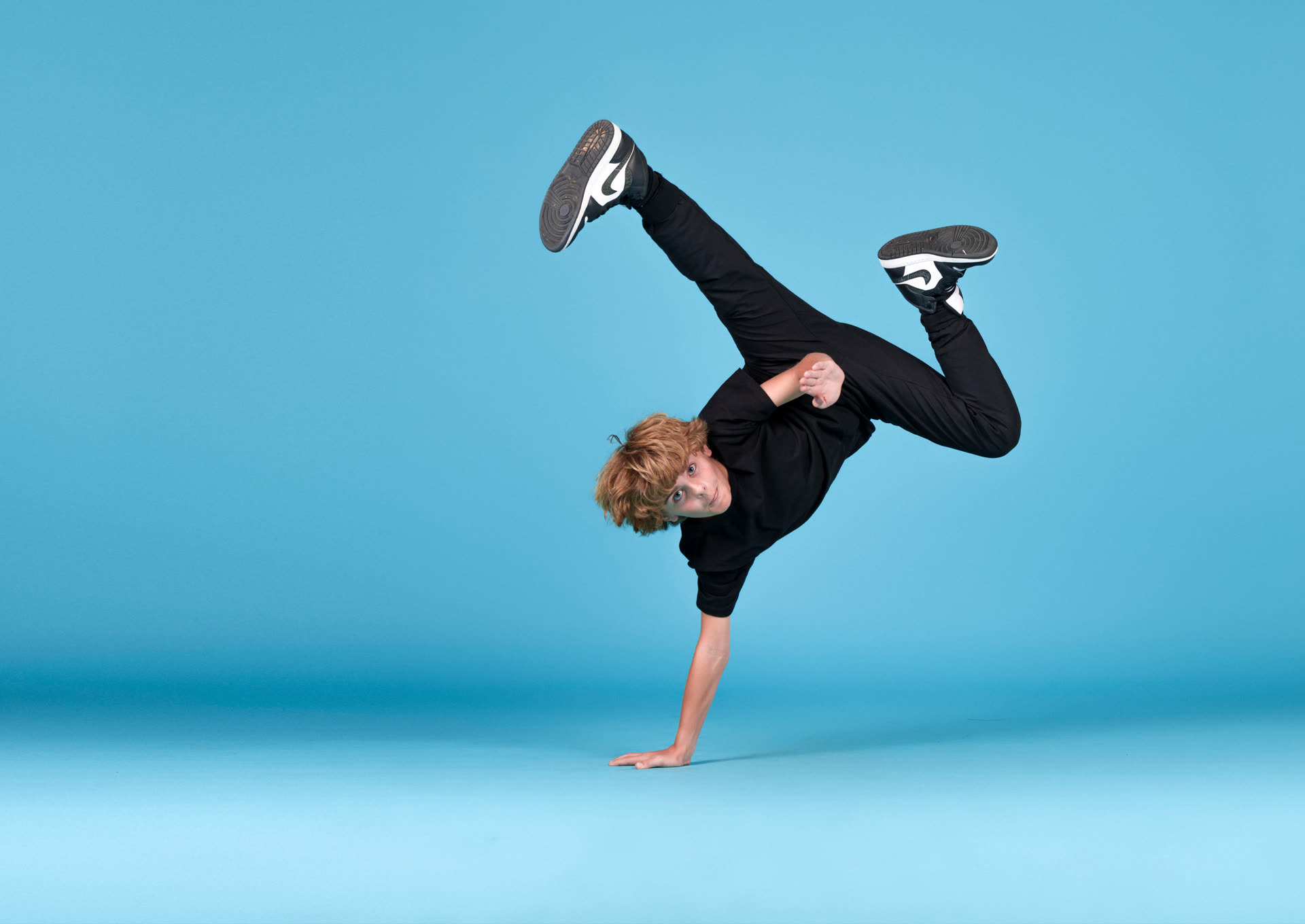 Hip hop dancer in a one-handed freeze