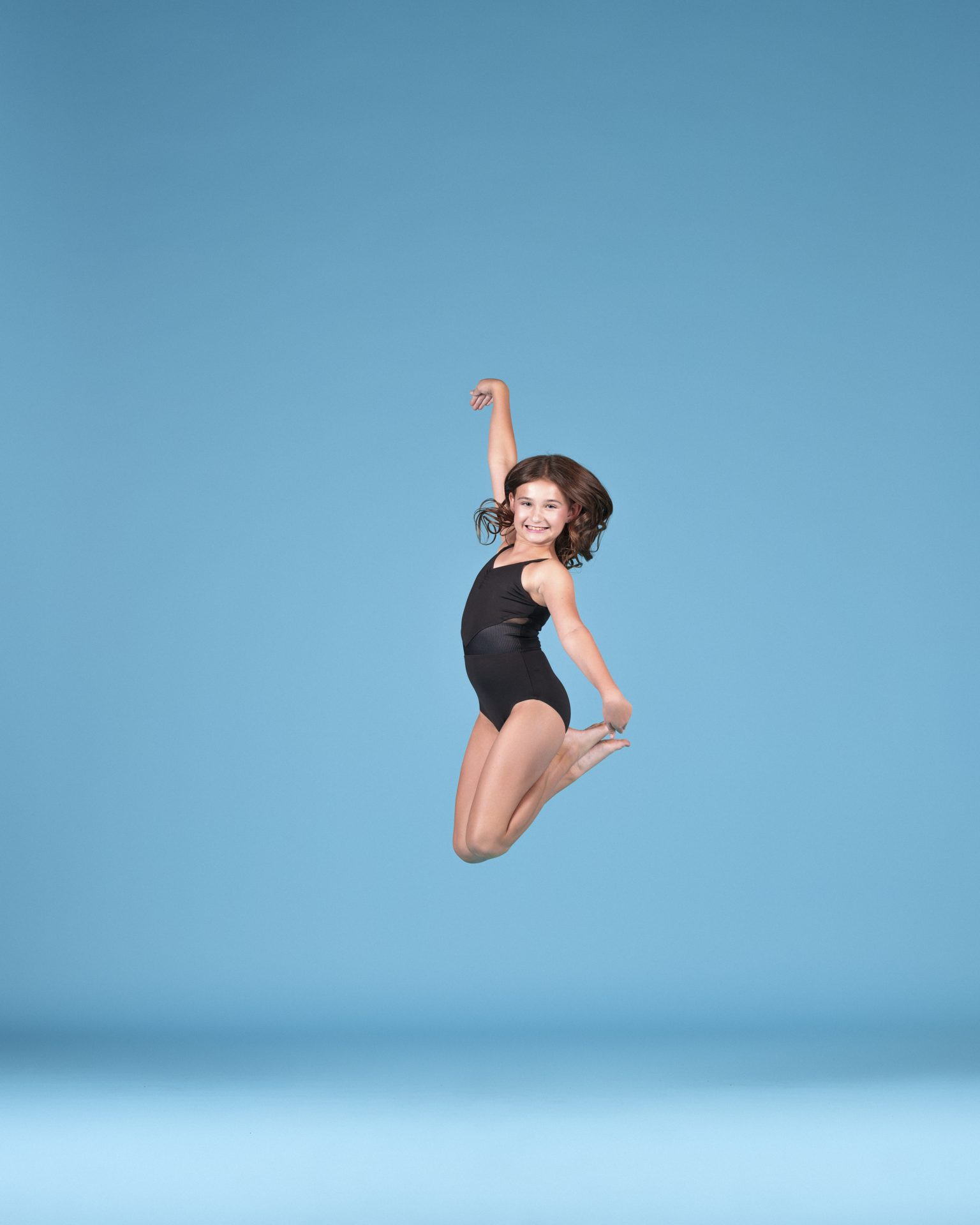 Young dancer in a joyful jump